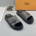 Grey UGG Slide Sandals with Gold Buckle and Stitched Sole
