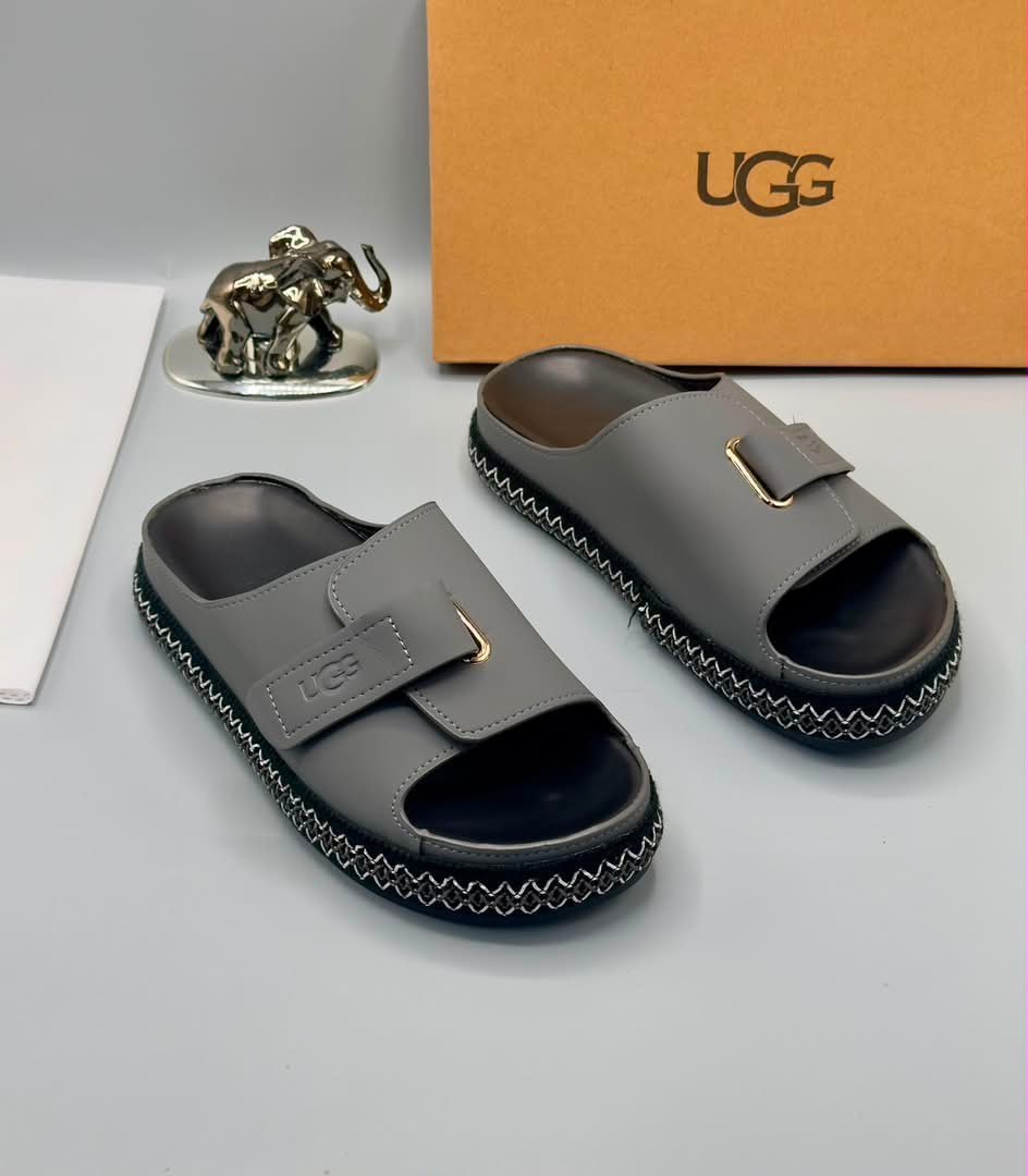 root-fhbl5K.jpeg Grey UGG Slide Sandals with Gold Buckle and Stitched Sole - Image 1
