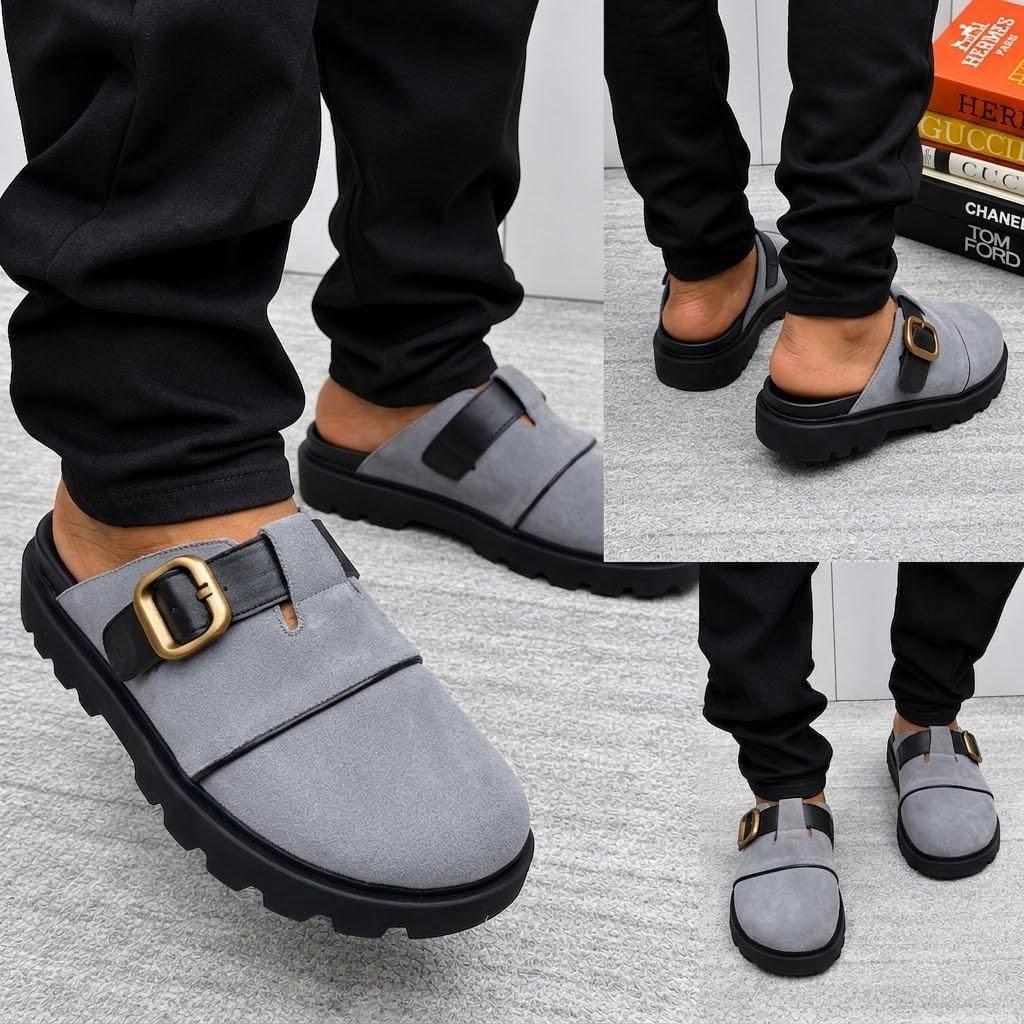root A stylish pair of grey half shoes with a gold buckle and black sole, perfect for adding a touch of luxury to any outfit.